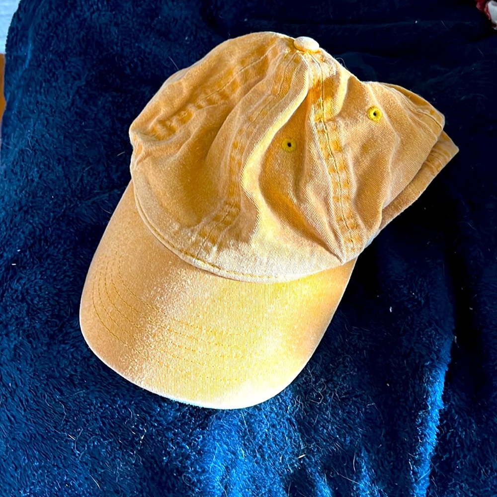 Plain orange hat. Lightly worn - purposefully faded style